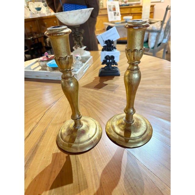 A pair of gilt wood carved candlesticks. Circa 1860, France.