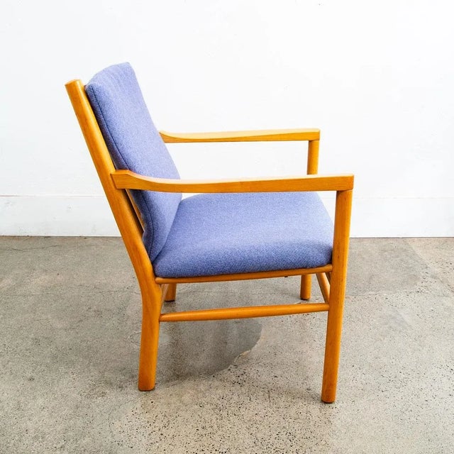 Solid beech wood lounge chair by Ole Erik Jorgensen with purple wool fabric. Unsigned example. Recently imported from...