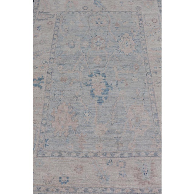 Modern Tribal Oushak With A Cream Border and Light Cool Gray-Blue Background. Country of Origin: Afghanistan; Type:...