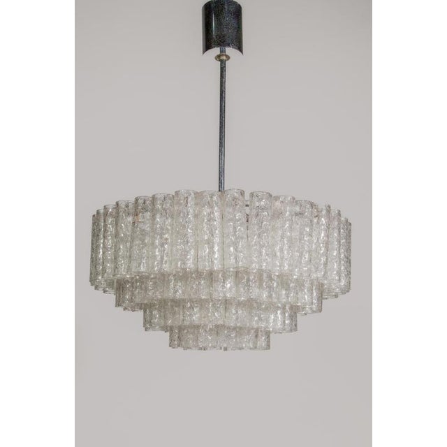Original 4 tiers iced glass tubes chandelier designed by doria luchten, 1960s, germany. In original good condition with...