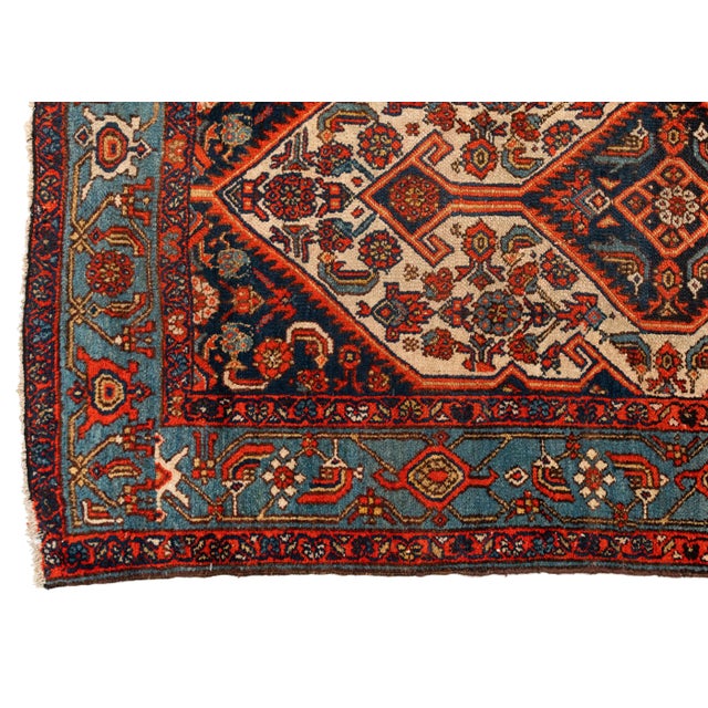 This is a lovely antique blue ivory red geometric Bibi runner rug hand knotted in Iran in the 1930s and measures 3.4 x...