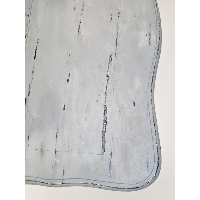 A Louis XV period commode with four drawers in three rows, made of walnut. The recent patina is in shades of blue-grey,...