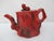Chinese red lacquer molded teapot, organic in design, made to look like a hollowed tree stump. Striking bright red color...