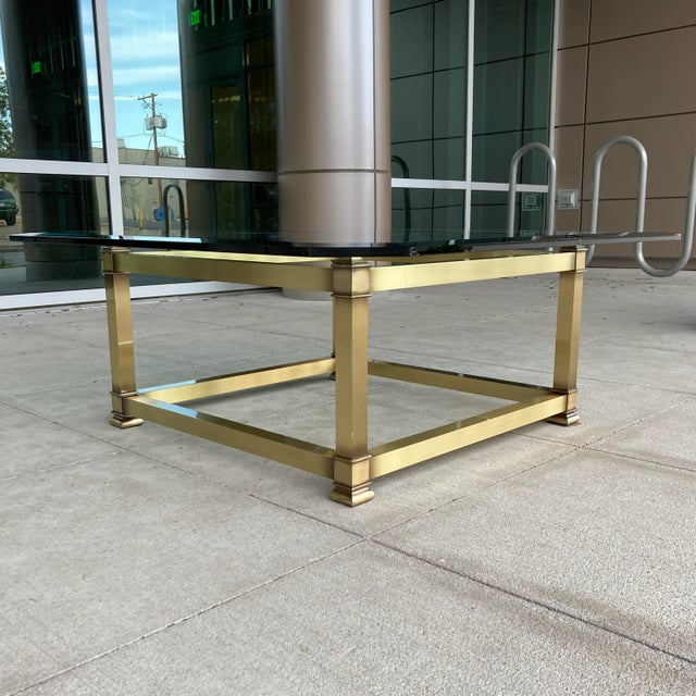 Fine brass profile base 3/4” thick chamfered edge glass top coffee table with square cut corners, manufactured in Italy...