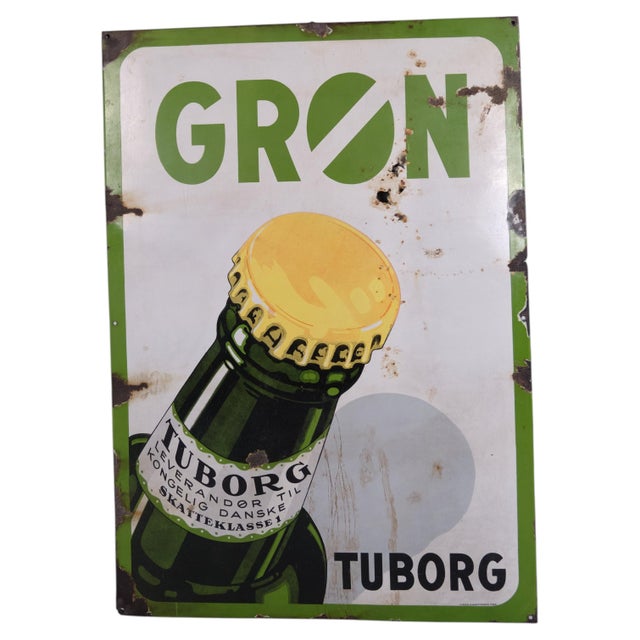 Original enamel advertising sign for Tuborg featuring the iconic Green Tuborg bottle. Tuborg was founded in 1873 near...