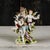 This refined porcelain sculpture depicts a lady with musician cherubs in a classic bucolic scene, a piece of great charm...