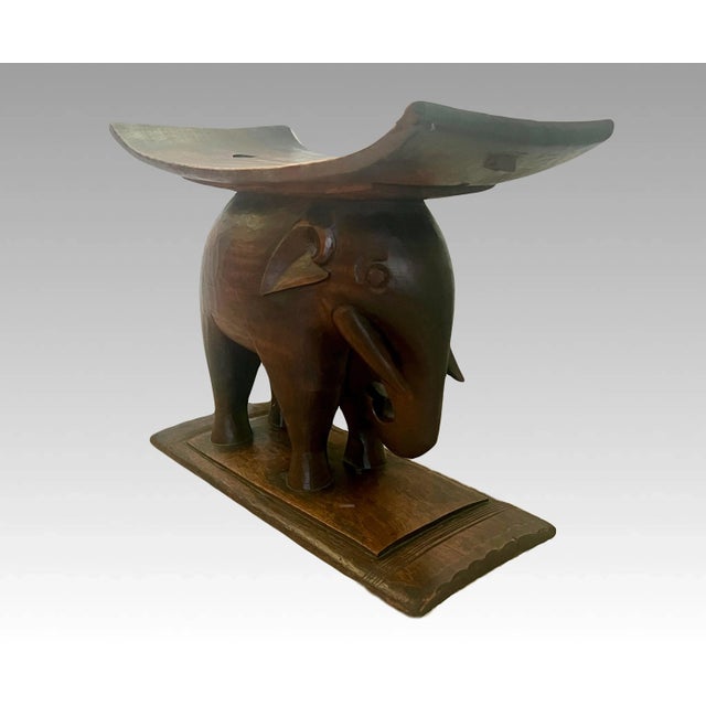 Older Ashanti / Asante tribal stool or support, mid 20th Century, hand-carved hard wood in the form of a nicely...