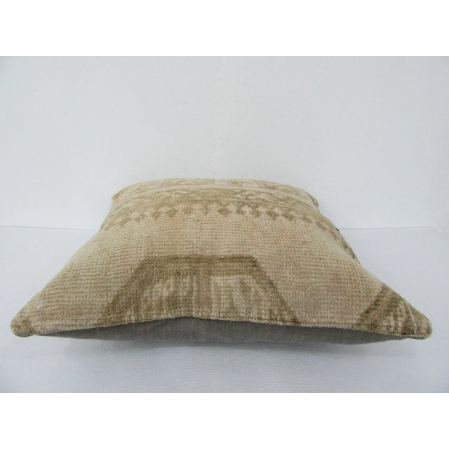 This is a pillow cover made from a vintage kilim rug. The piece was properly washed and ready to use. Pillow inserts not...