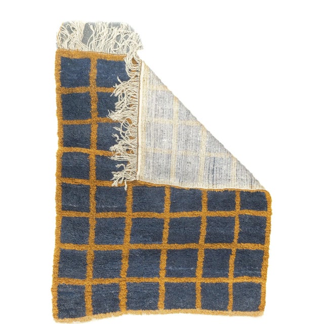 A six by eight orthogonal lattice in orange-rust is set on a slate field generating rough squares, a long, nearly shaggy,...