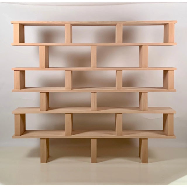 Six shelves 'Verticale' polished oak shelving unit. Highest quality solid oak construction. Comes in 3 parts connected...