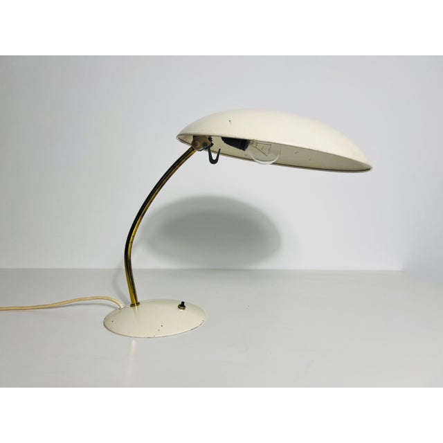 This vintage table lamp, crafted in Germany during the 1960s, is a stunning example of Bauhaus-inspired design. Featuring...
