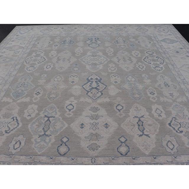 Turkish Oushak Rug With Soft Gray Field and Pale Blue Geometric Motifs For Sale - Image 12 of 16