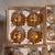 A set of fine European hand blown silver and gold glass ornaments made in West Germany embellished with braided foil trim....