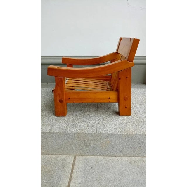 Brutalistic swedish armchair in pine from the 70s in unrestored condition. The cushions needs a new polstery. The foam is...