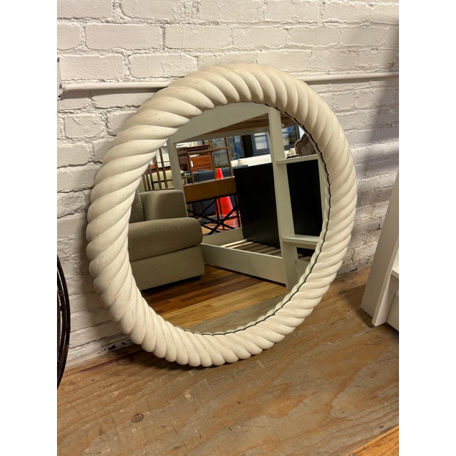 Design Plus Gallery presents a Vintage Wall Mirror with a Wrapping Twist Frame. The mirror is framed by a sculptural twist...