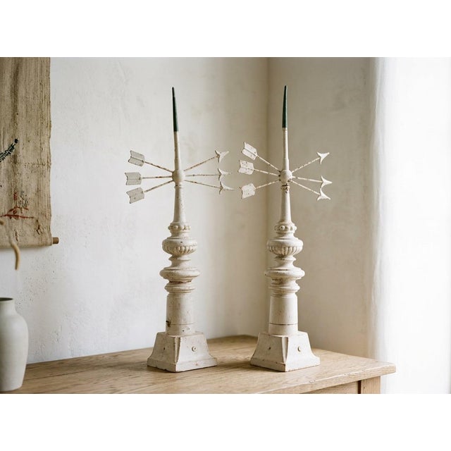 A pair of 19th Century French cast iron weather vane with triple arrows and copper sheathed tip. White painted patina with...