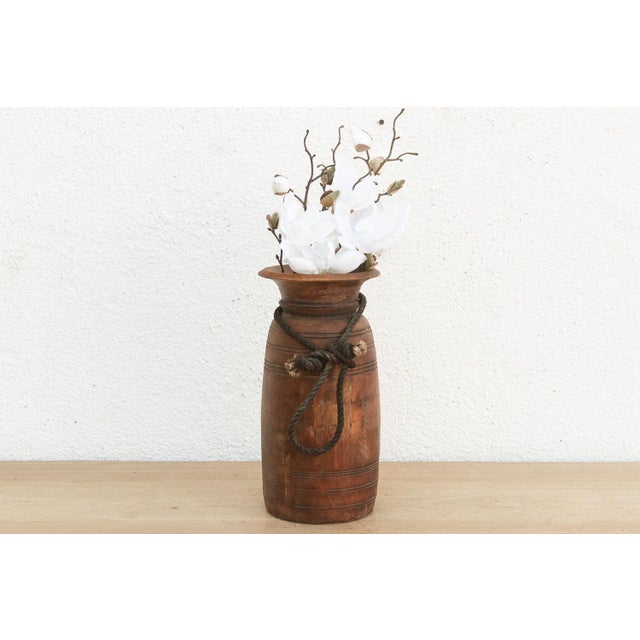 Originally used in village homes for storing milk, ghee, or grains, this antique wooden pot has survived generations of...