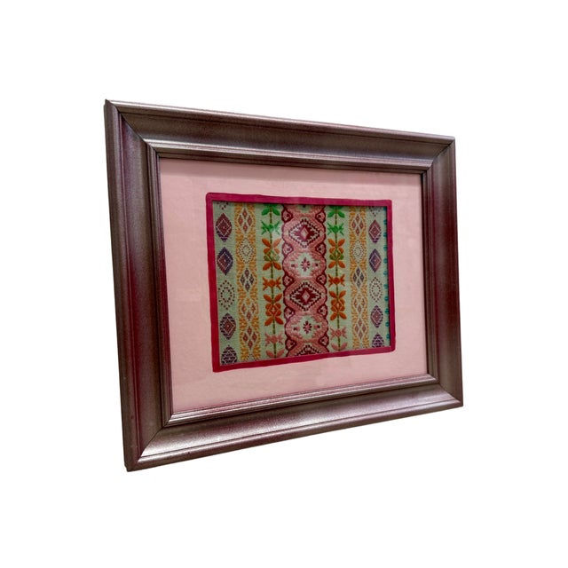 Roxie is a one of a kind framed textile artwork featuring Schumacher’s Cosima Embroidery, a richly detailed designer...