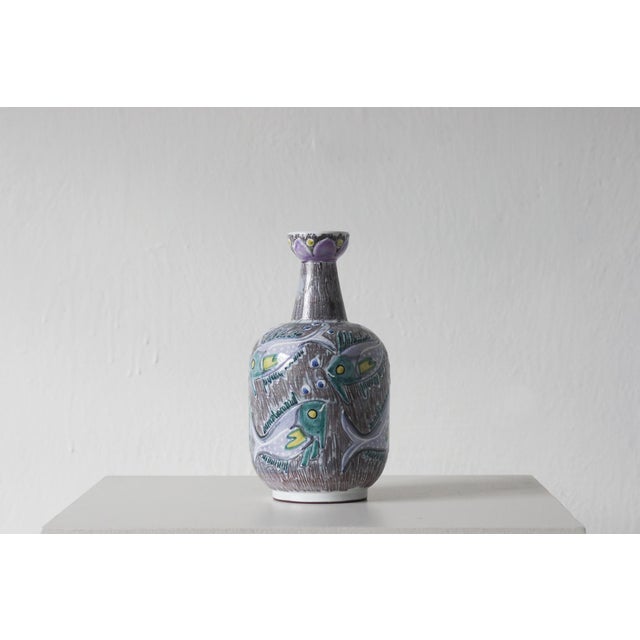 An exceptionally decorative Swedish ceramic vase from the Laholm Keramik workshop, embodying the combination of raw...
