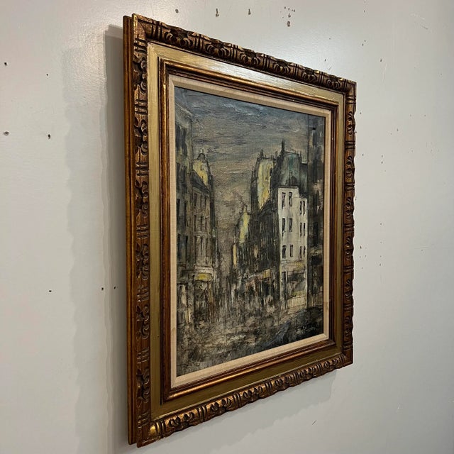 Fine art cityscape oil painting made by W. Stevens. This work is framed and ready to hang with hanging wire on back.