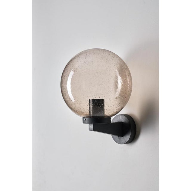 This wall lamp is a fixture from the Boom collection, manufactured by Bega in Germany during the 1970s. The design...