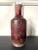 A large Chinese vase with Sang-de-Boeuf (oxblood) glaze in a classic baluster form with a tall narrow neck and horizontal...