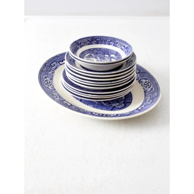 Collection of vintage Homer Laughlin Blue Willow Ware dishes, circa 1941–1946, showcasing the iconic Japanese-inspired...