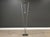 A post modern floor lamp by Ron Rezek made of brushed steel. Sphere twists as a dimmer and on off switch. Circa 1970’s....