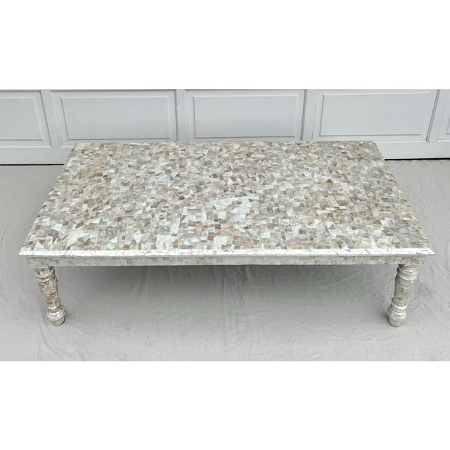 Here is an absolutely stunning rectangular coffee table covered in mother of pearl. The table features Moorish-inspired...