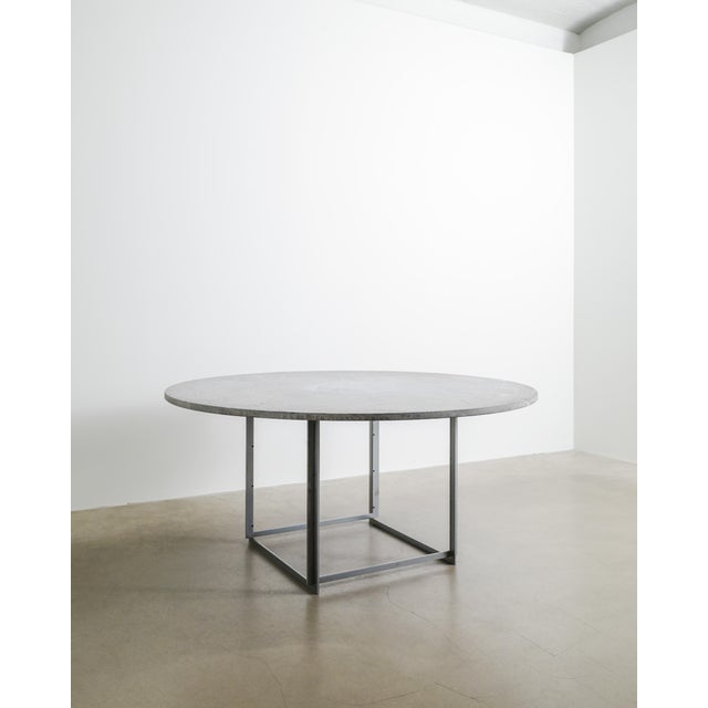 A rare and iconic round danish mid century "pk54" dining table in chromed plated steel with a very beautiful light grey...