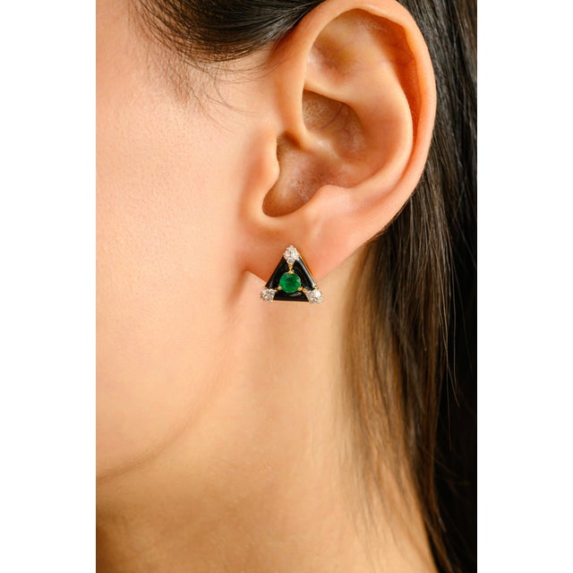 A bold expression of vintage charm and modern artistry, these striking stud earrings are expertly crafted in 14k yellow...