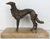 About A 19th century French silver patinated bronze greyhound on a cream marble base. A beautiful depiction of this sleek...