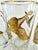 This elegant mid-century set of six highball glasses showcases a striking design featuring detailed gilt ducks in flight....