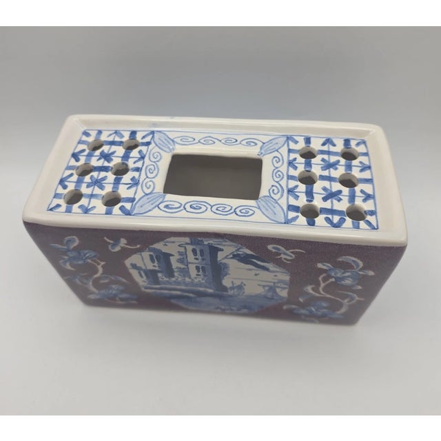 Bring timeless Dutch craftsmanship and Colonial American heritage into your home with this **Vintage Delft Blue Flower...