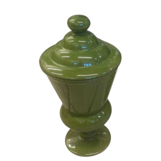 This elegant vintage ceramic urn features a striking, classical silhouette finished in a rich, highly glossy olive-green...
