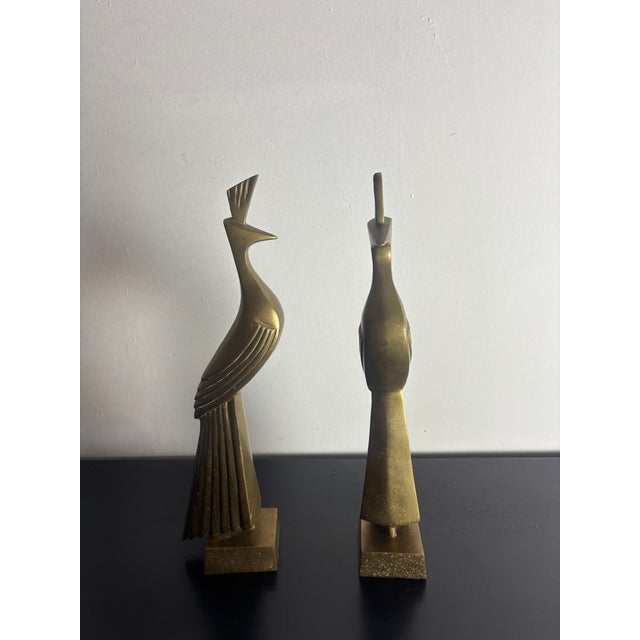 Striking pair of vintage brass peacock sculptures in a stylized art deco/midcentury modern form. Original seal from Dara...