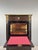 An elegant antique secretary desk from the Napoleon III period, crafted from ebonized wood and richly decorated with...