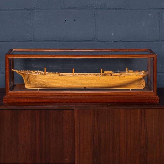 An exceptional early 20th century maritime club house model of an unriggered four-masted vessel, finely planked and framed...