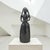 Large Mexican folk art sculpture depicting a mother and child rendered in black clay with a slip finish. Standing 19.5...