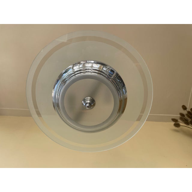 A beautiful lamp from the 1930s Art Deco period in France. The lamp features a chrome-plated pendant supporting an etched...