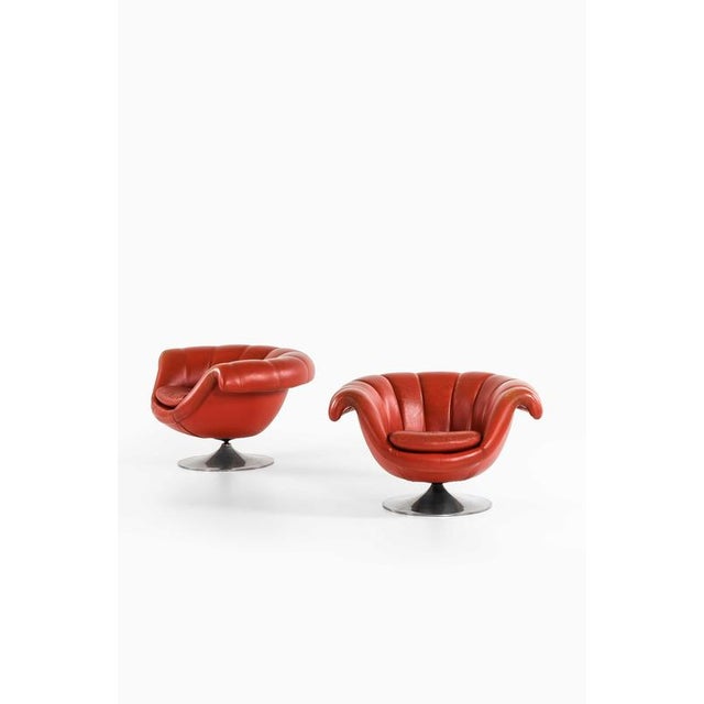 This rare pair of easy chairs, attributed to lennart bender and produced in sweden, presents a bold and sculptural...