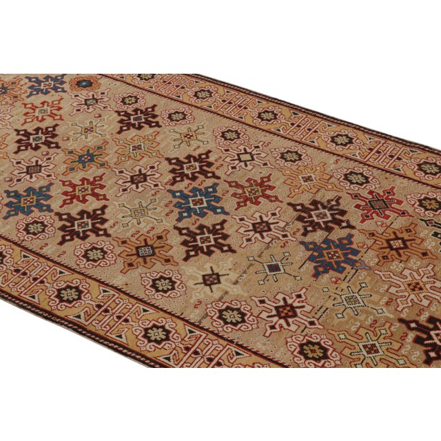 Originating from Russia between 1880-1890, this antique geometric runner enjoys a wrapping border and unique Kuba field...