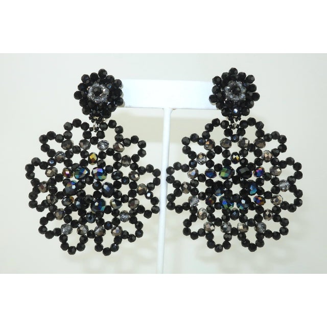 1980's faceted black glass bead earrings in a snowflake style design that lends itself to a black lace appearance. The...