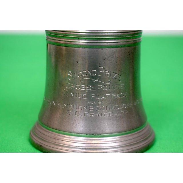Sz: 3 3/4"H x 3 7/8"D at base Two mugs, including: "Second Prize, Grosse Pointe, Oct. 17 1925, 3 1/2 Mile Steeplechase";...