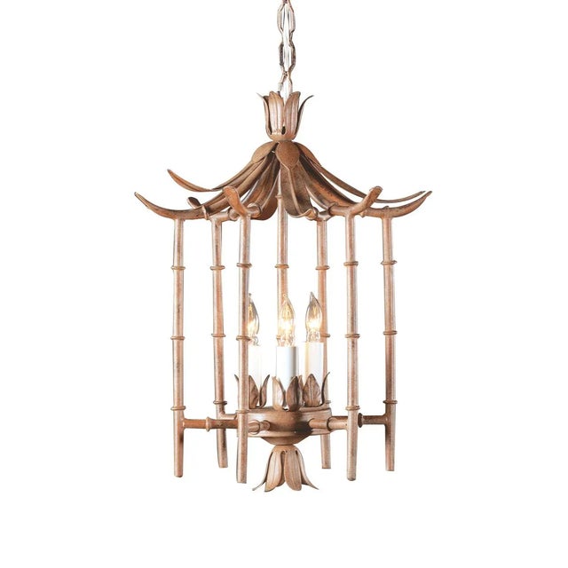 This is a Wildwood Lamps wrought iron bamboo lantern. The piece features an art Glaze and 3 lights.