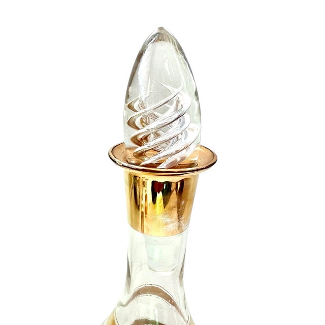 This gracefully designed decanter is accented with a delicate band and lines in 24k gold. Pair with the set of two...