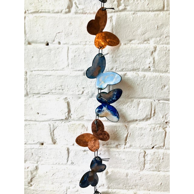 Doesn't your wall deserve some jewelry? This exquisite handmade blue butterfly sculpture resembles an oversized necklace,...