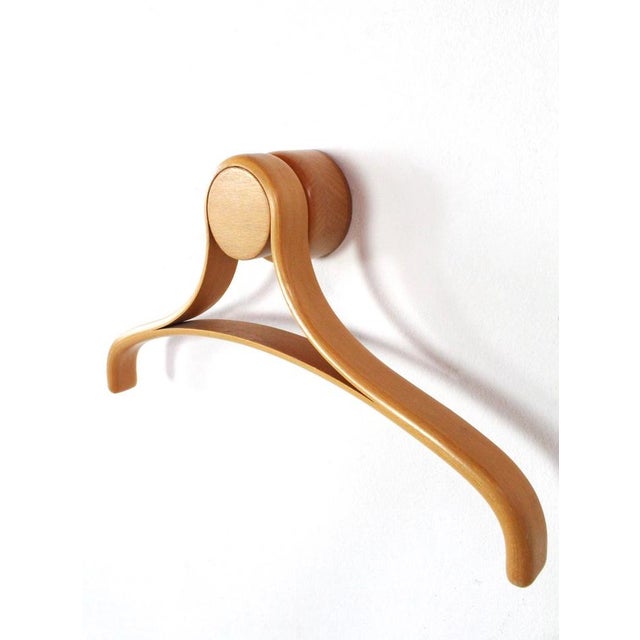 Coat hangers of Beech designed by Roald Steen Hansen for World Pictures Copenhagen presented at Moma New York. The hangers...