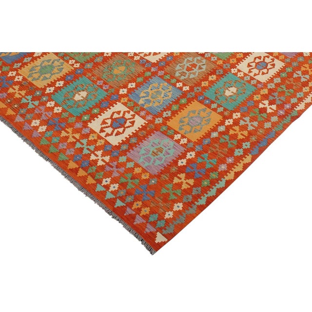 Add a touch of elegance to your home with this casual chic hand woven Tribal Kilim wool rug. Constructed on a loom by...