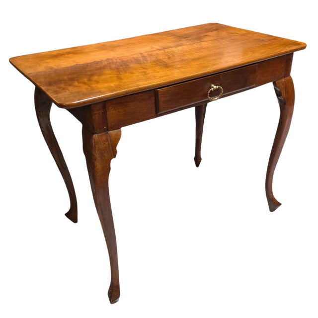 An evocative example of traditional provincial furniture, this antique writing table is distinguished by its beautifully...